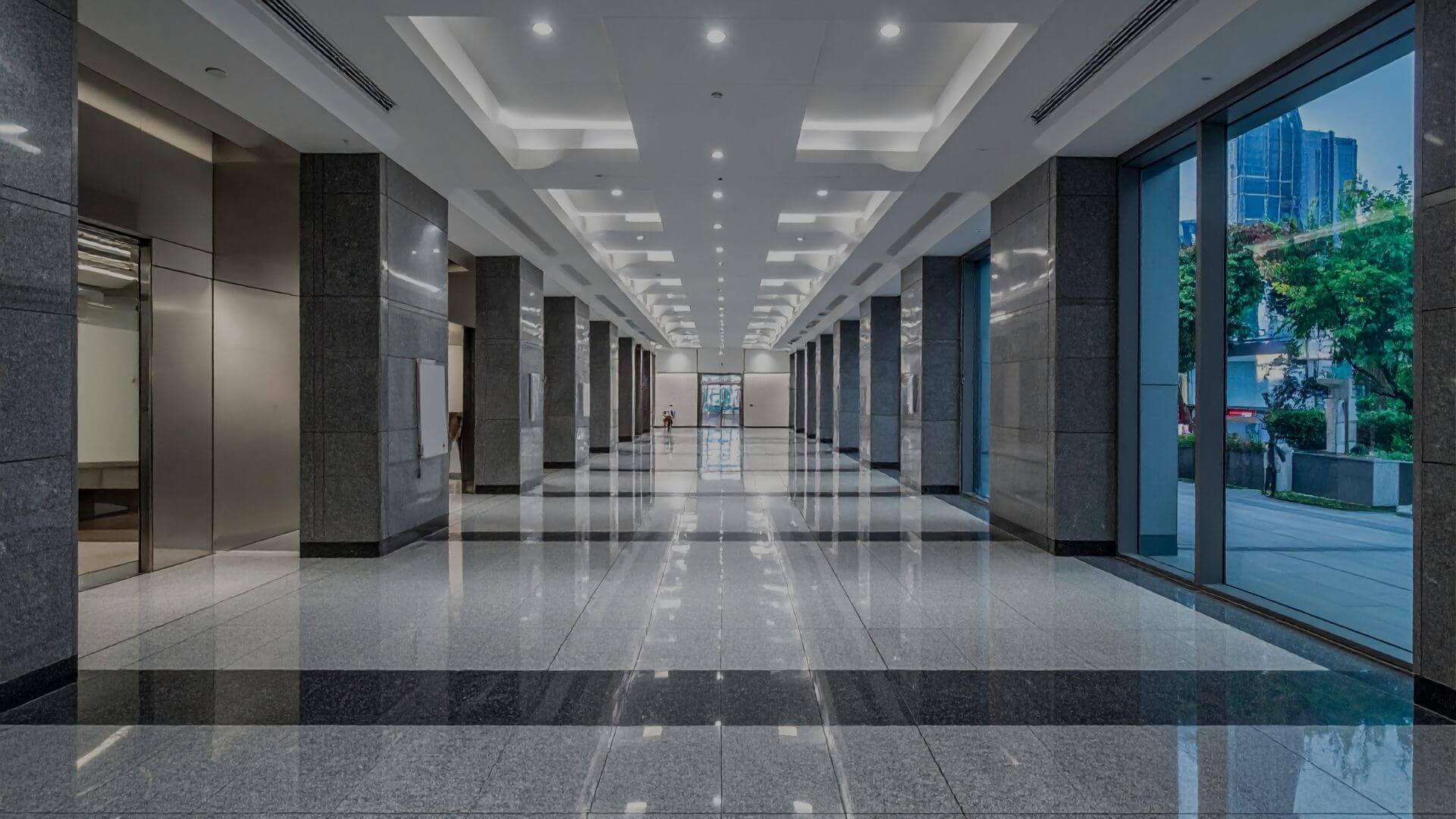 Modern commercial office interior with collaborative workstations, professional furnishings, and clean hallway environment in Stockton, CA.